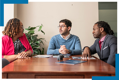 Dr. Wright speaks to two GSEHD doctoral students