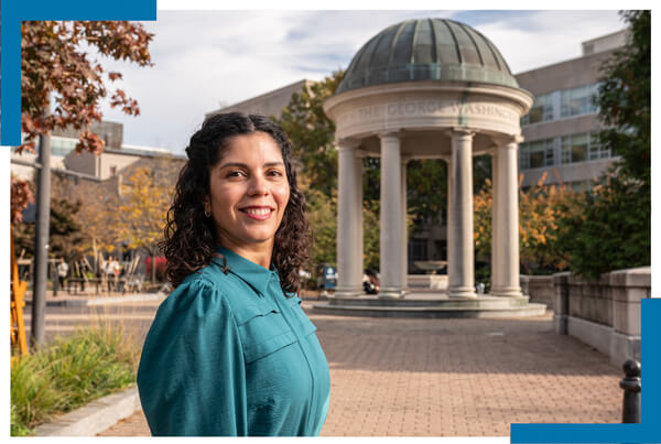 Sandra Cruz smiles at the camera, Tempietto in GW Student Plaza in the background